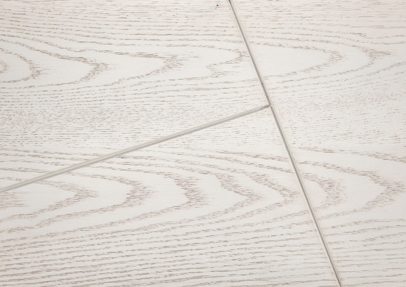 Close-up of a tiled floor with a light wood pattern