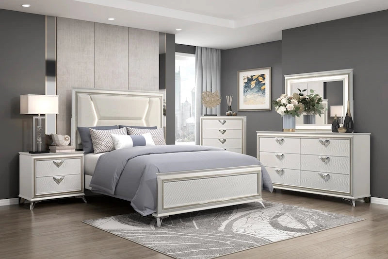 White and gold modern bedroom set with LED upholstered headboard, acrylic and metal legs, dresser, mirror, chest, and nightstand.