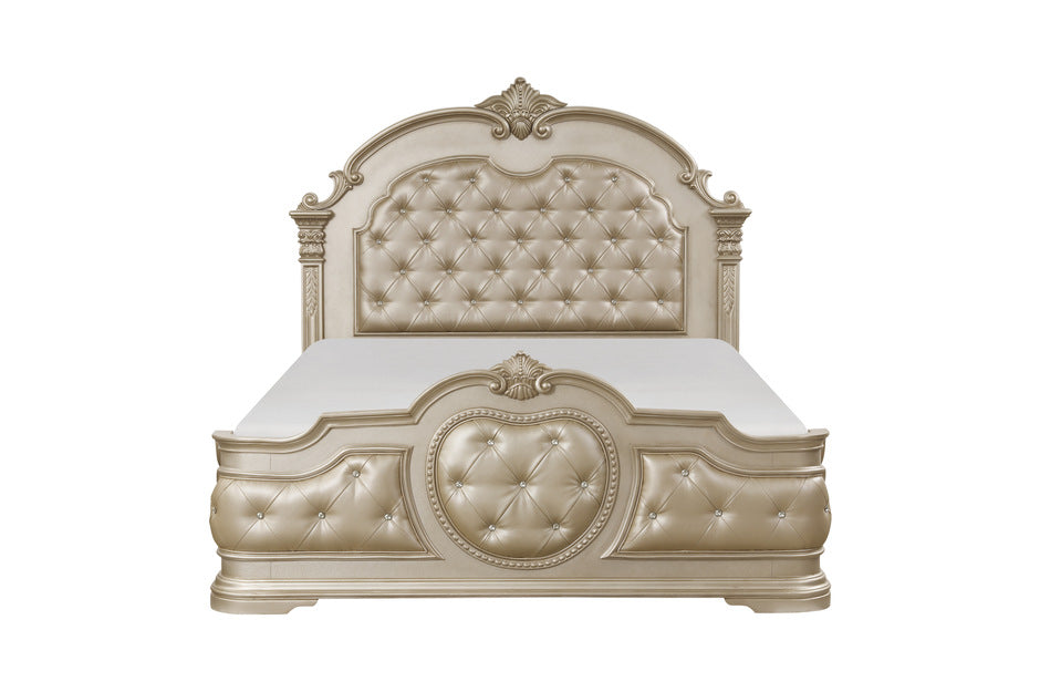Antoinetta king panel bed showcasing intricate acanthus leaf carvings, warm cherry veneers, and gold-tipped detailing in a champagne finish.