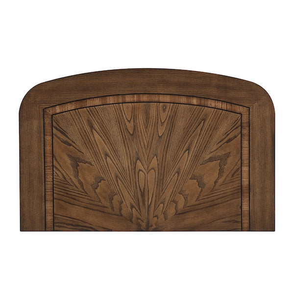 Wooden headboard with decorative carvings on a white background