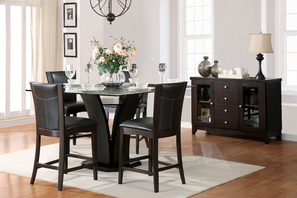 Dining room with a dark wood table and chairs, sideboard, and decor.