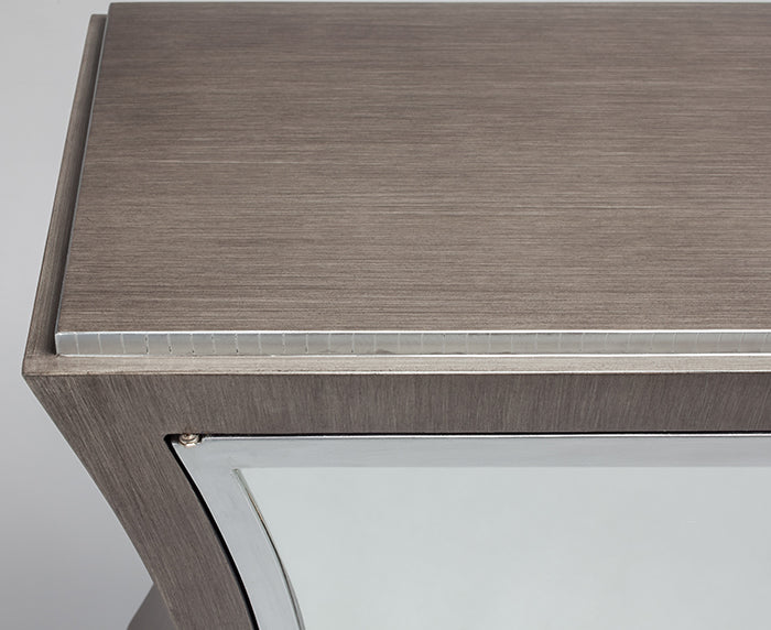 Close-up of a wooden surface with a glass panel