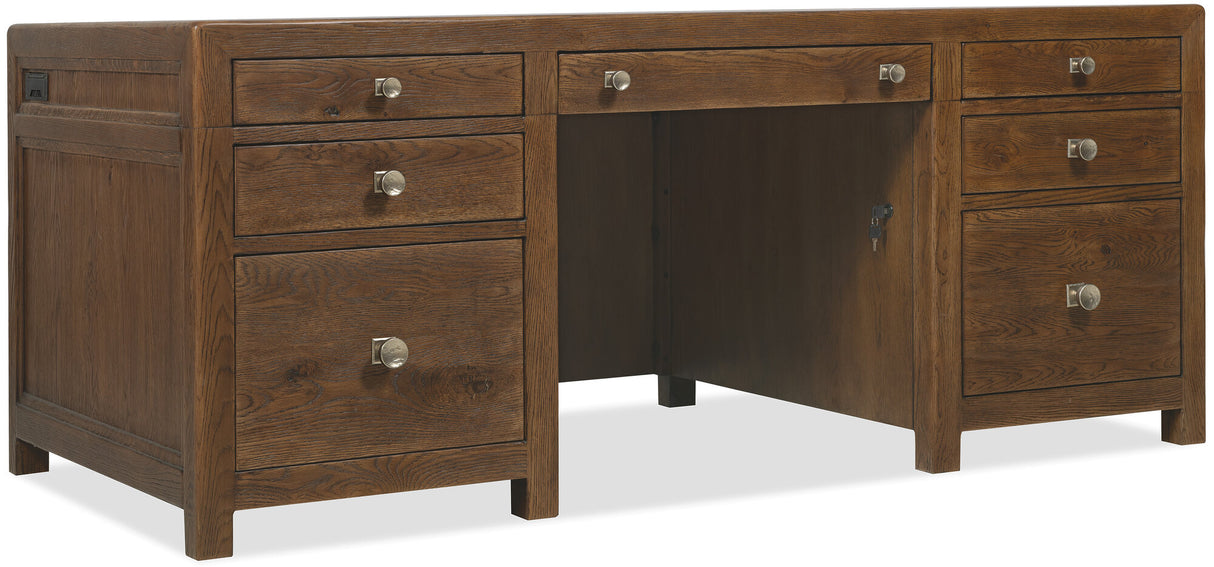 Wooden desk with multiple drawers on a white background