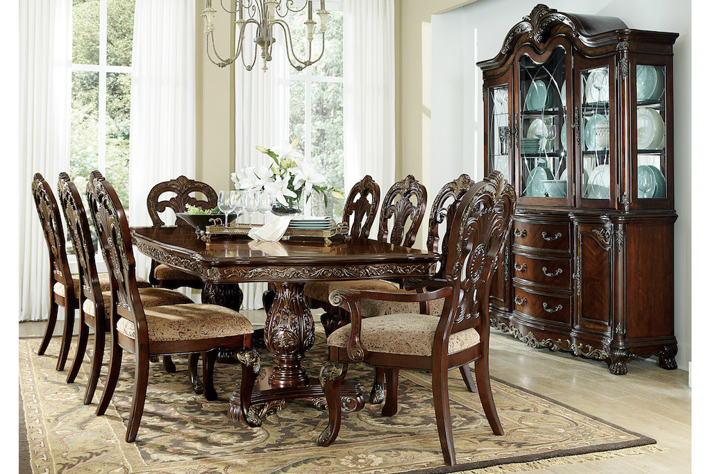 Dining room with wooden furniture including a table, chairs, and a china cabinet.