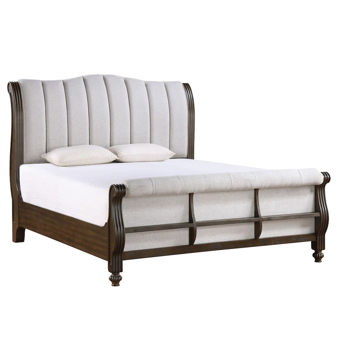 Sleigh bed with upholstered headboard and wooden frame on a white background
