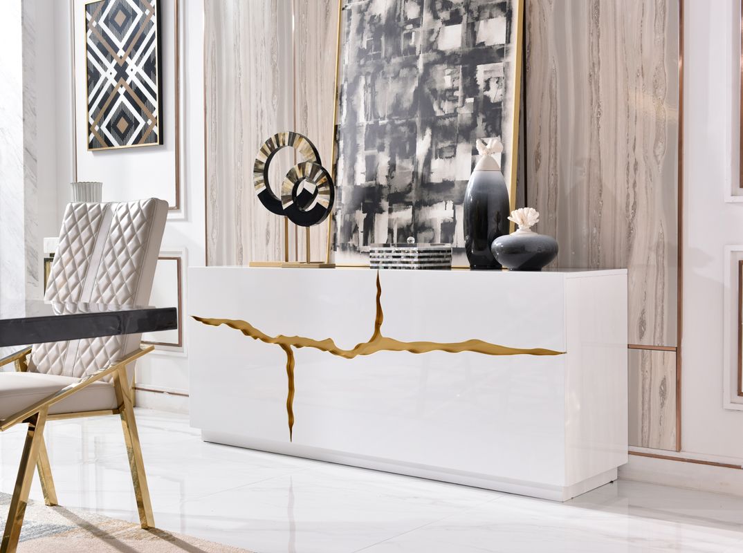 Modern white reception desk with gold accents in a stylish interior setting.