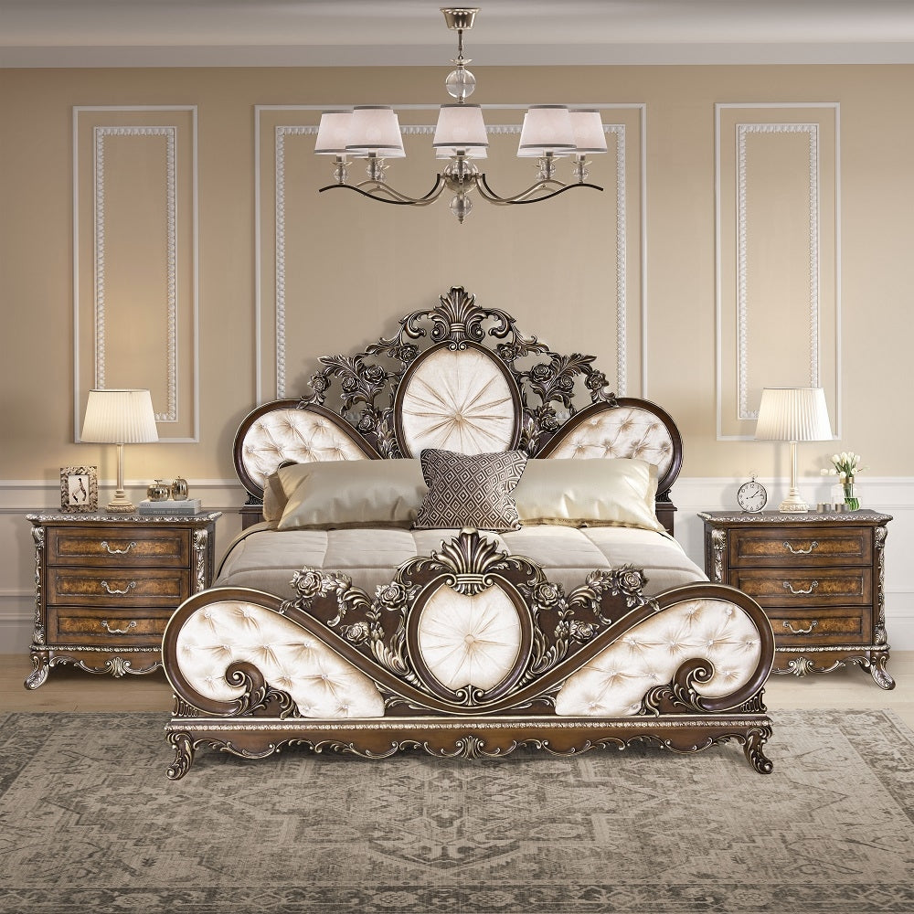 Luxurious bedroom with ornate bed and matching nightstands.
