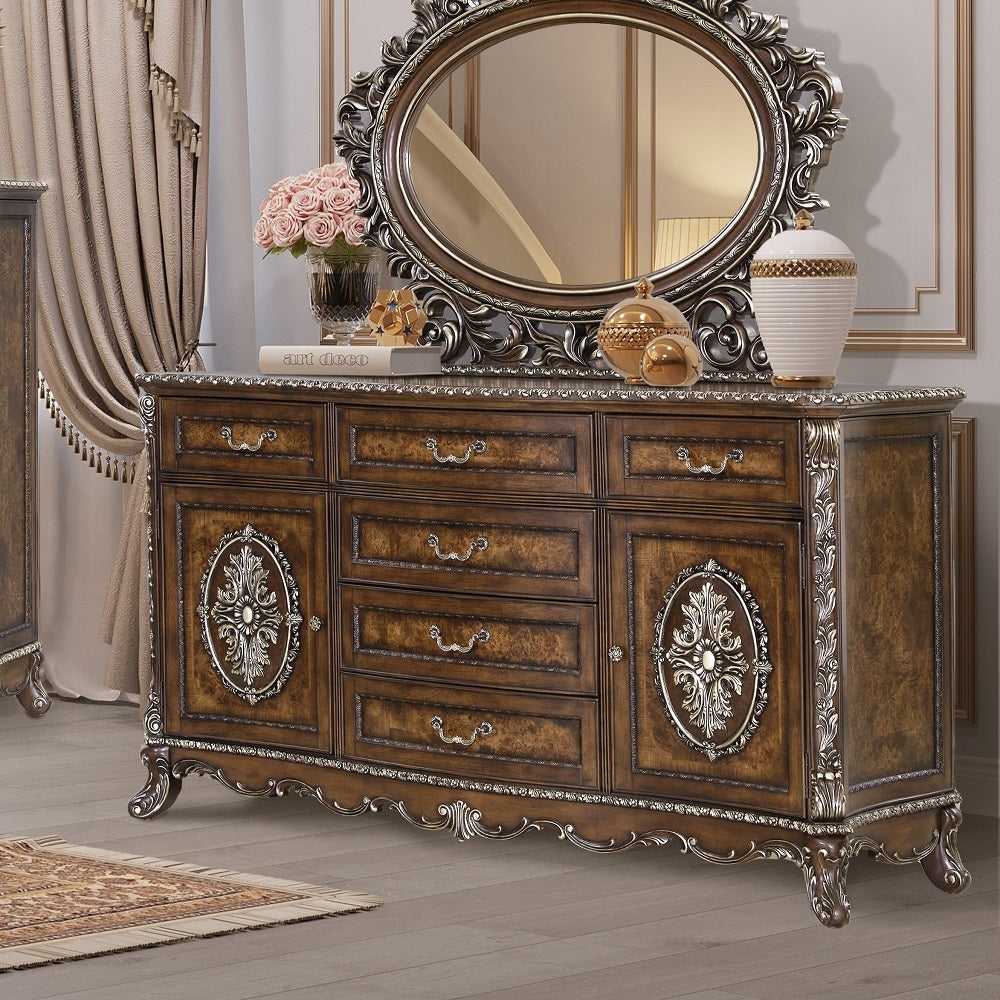 Decorative wooden dresser with ornate mirror and embellishments in a room setting.