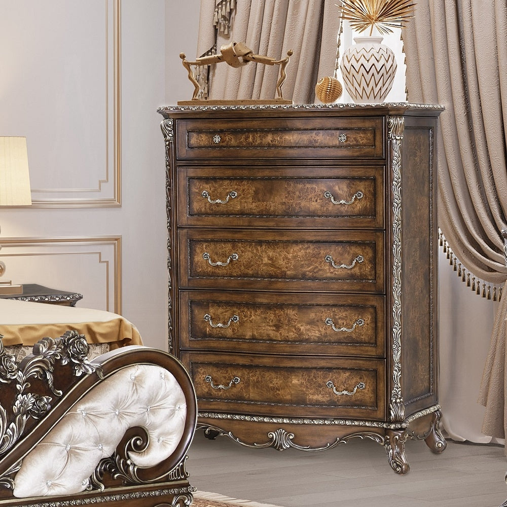 Decorative wooden dresser with intricate carvings in a bedroom setting.