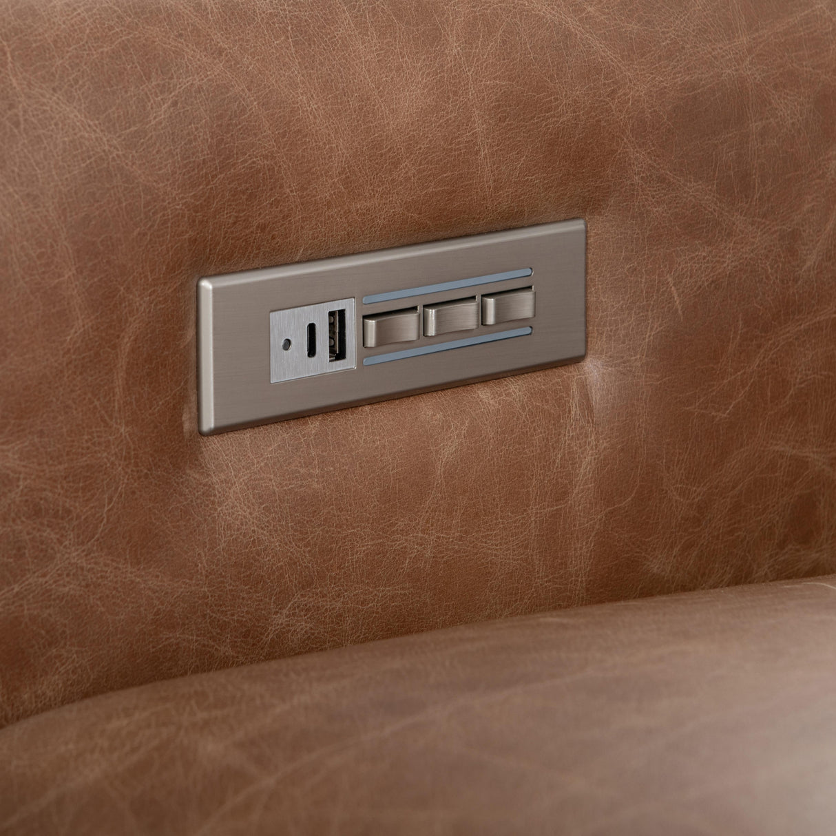 USB charging port on the Lioni Leather Power Motion Sofa by Bernhardt, allowing for device charging while reclining