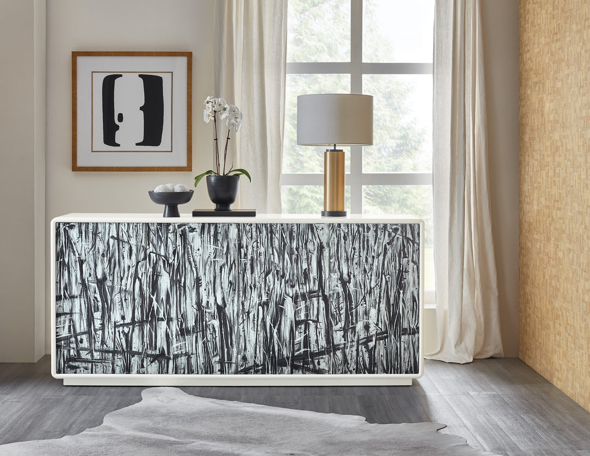 Lifestyle view of the Hooker Furniture Mélange Graffitio Credenza with hand-painted abstract doors in white, gray, and black.