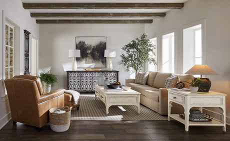 Elegant living room furniture set featuring a stylish sofa, coffee table, and accent chairs in a modern home setting.