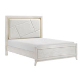 White upholstered bed with geometric headboard design on a white background