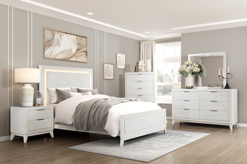 Neatly arranged bedroom with white furniture including a bed, nightstands, and dresser.
