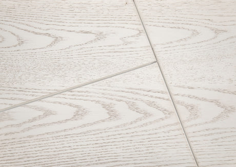 Close-up of a tiled floor with a light wood pattern