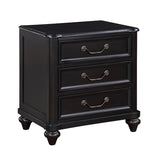 Black three-drawer nightstand with brass handles on a white background