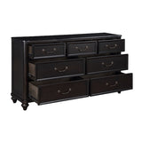Black dresser with multiple drawers on a white background
