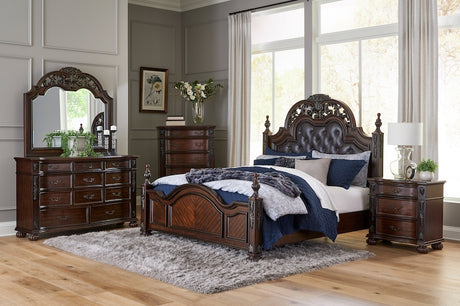 Adelina Bedroom Set in cherry finish with tufted faux-leather headboard and carved details. Includes bed, dresser, mirror, nightstand, and optional chest. Traditional design by Homelegance.