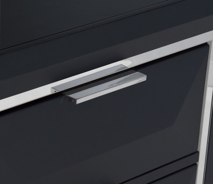 Close-up of a black cabinet with chrome handles