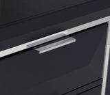 Close-up of a black cabinet with chrome handles
