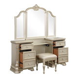Beige vanity with mirror, drawers, and stool on a white background