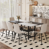 Juego de mesa y sillas. Mesa de comedor unida en blanco y negro de 71 x 35,4 pulgadas con función de almacenamiento en el medio de las patas de la mesa. Combina con 8 sillas de PU gris claro cálido con diseño de cojín curvo ensanchado.