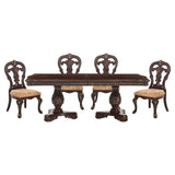 Dining table set with four ornate chairs on a white background