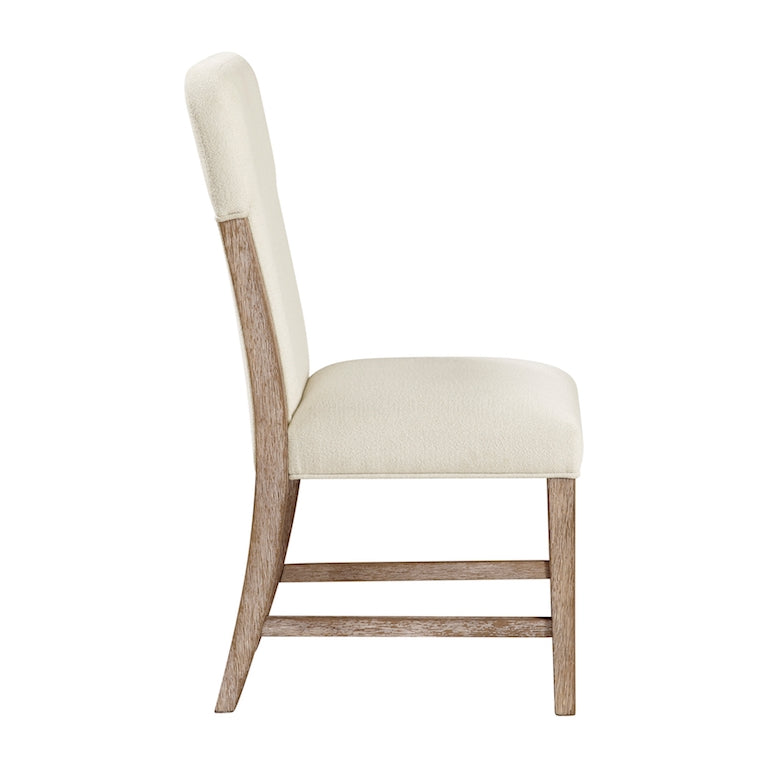 Chair with cream cushioned seat and backrest on a white background