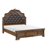 Wooden bed with tufted brown headboard on a white background