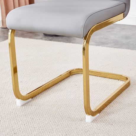 Table and chair set.Elegant Transparent Tempered Glass Dining Set - 71'x35.4' with 8 Light Gray PU Chairs with golden C-tube metal leg. - sold by Home Elegance USA