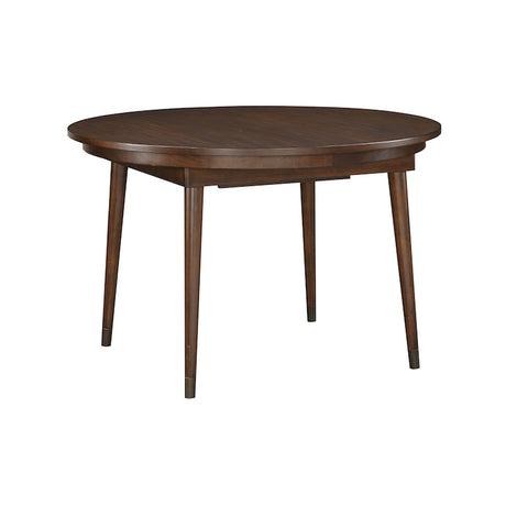 Round wooden dining table on a white background