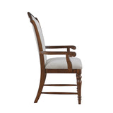Wooden chair with white cushioned seat and backrest on a white background