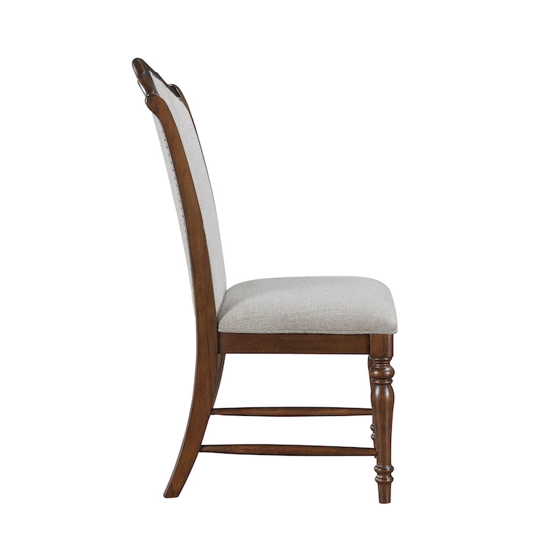 Wooden chair with a white cushion on a white background