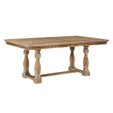 Wooden dining table with turned legs on a white background
