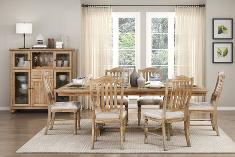 Dining room with wooden furniture, including a table and chairs, and a sideboard.