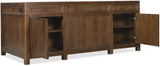 Wooden sideboard with open doors on a white background