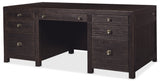 Dark wood desk with multiple drawers on a white background