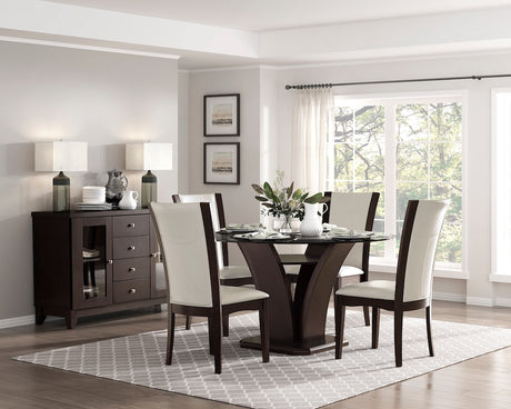 Dining room with a dark wood table and chairs, sideboard, and large window.