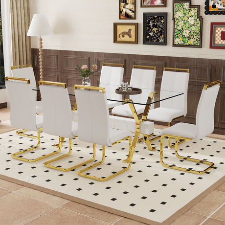 Table and chair set.Elegant Transparent Tempered Glass Dining Set - 71'x35.4' with 8 White PU Chairs with golden C-tube metal leg. - sold by Home Elegance USA