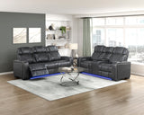 Modern living room with black leather recliner sofa set and coffee table.