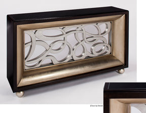 Decorative wall art piece with intricate design in a black and gold frame on a white background