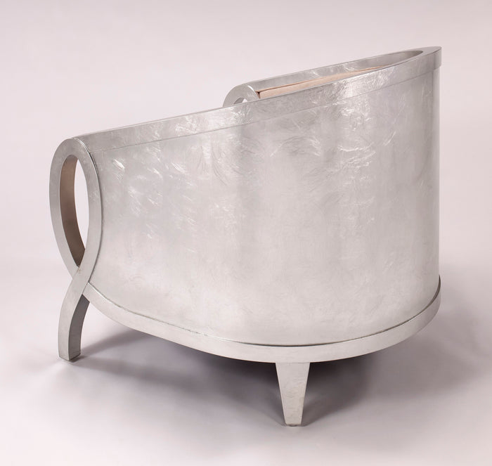 Silver metallic chair on a white background