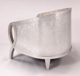 Silver metallic chair on a white background