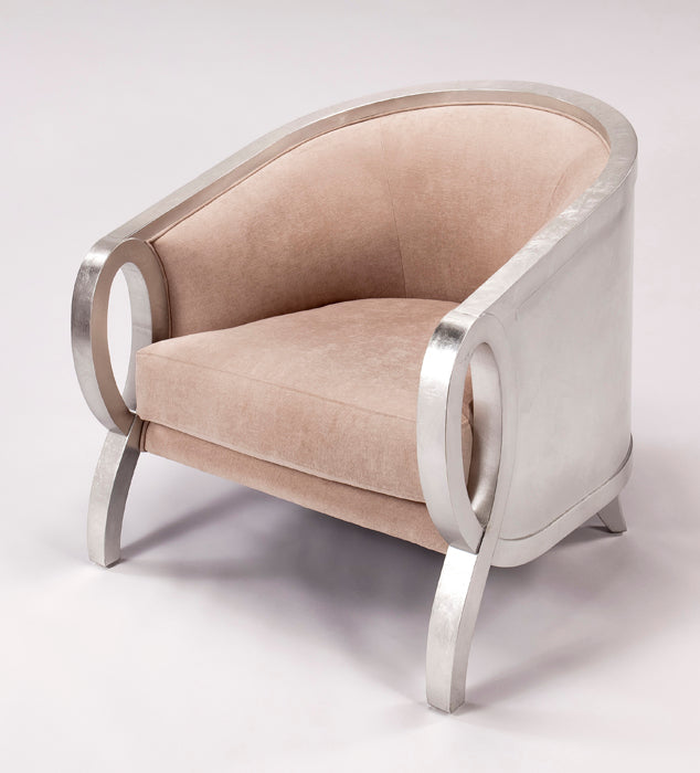 Beige armchair with silver metal frame on a white background