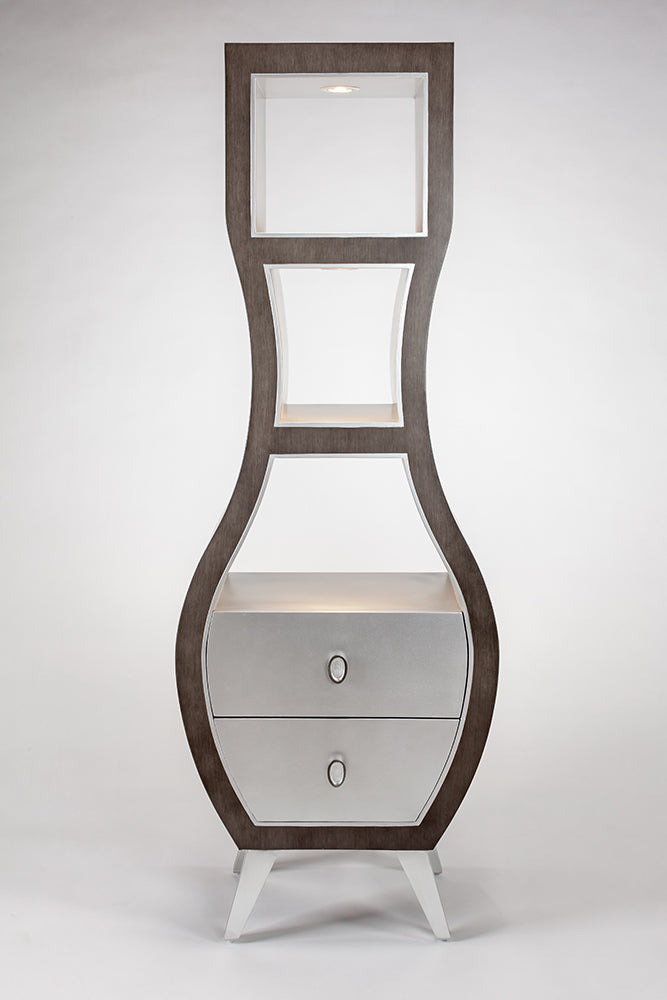 Tall, narrow wooden cabinet with glass panels and a drawer on a white background
