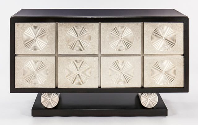 Decorative console table with circular patterns on a white background