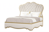 Decorative bed with tufted headboard and Ivory bedding on a white background