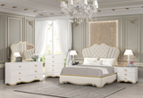 Luxurious bedroom with Ivory furniture, including a bed, dresser, and nightstands, in a stylishly decorated room.