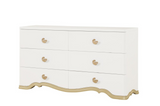 Ivory dresser with gold accents on a white background