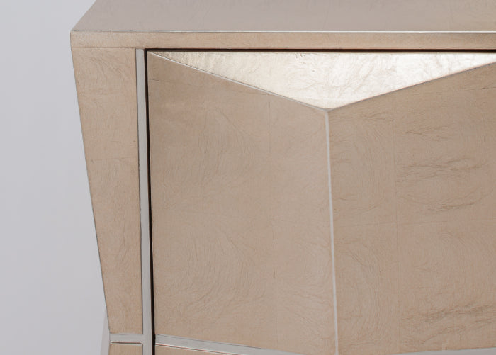 Close-up of a wooden cabinet with a light finish on a plain background